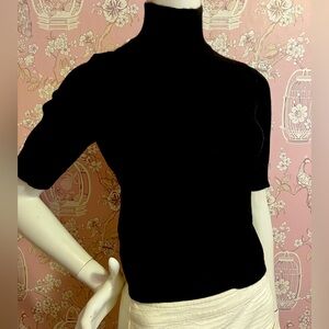 woman’s black  cashmere mock neck sweater